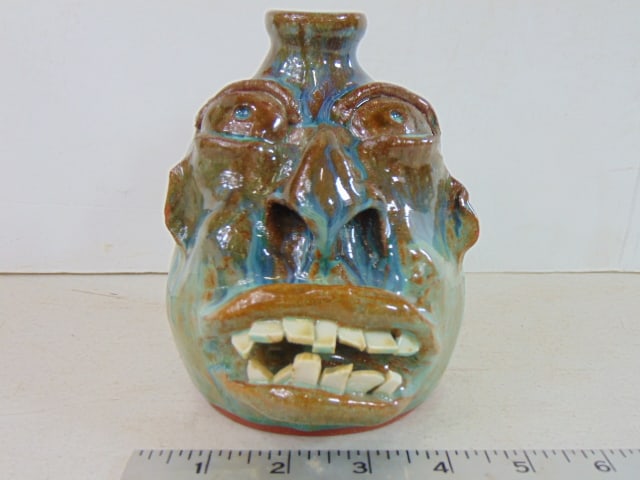Small face jug by Amadeo Salamon, glazed in brown, green & blue, height is 6" (1 of 5)