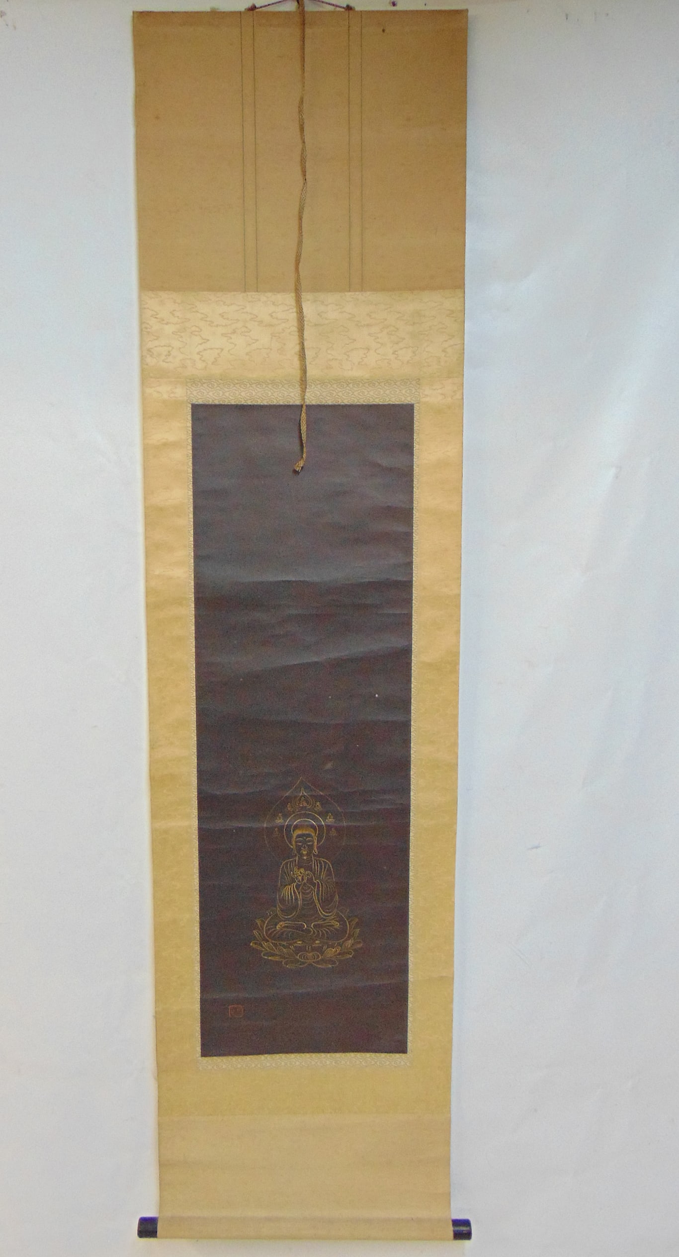 Chinese scroll, Gold Buddha on black field, scroll is 69" by 17.5", scene is 37.5" by 12": Chinese scroll, Gold Buddha on black field, scroll is 69" by 17.5", scene is 37.5" by 12"