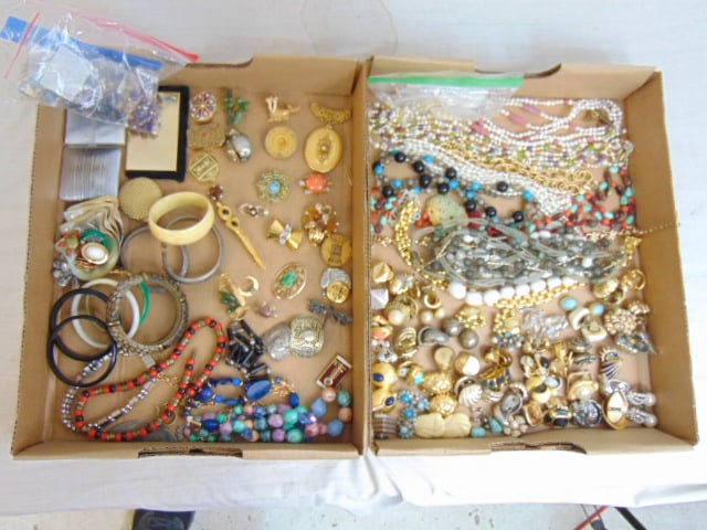 Large lot of costume jewelry to include Miriam Haskell locket pendant; Kenneth Lane "coral" turtle; (1 of 8)