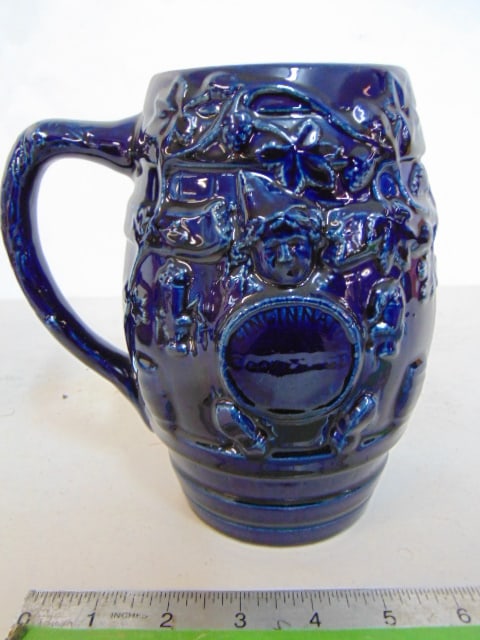 Early Rookwood art pottery glazed beer mug, in deep blue, with putti scene (1 of 4)