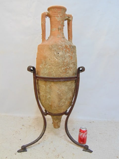 Terra cotta amphora on wrought iron base, urn is encrusted with shells, height is 39" (1 of 4)