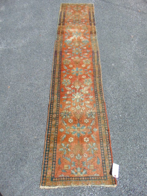 Parsian runner, in orange with floral designs, worn, 9'4" by 24": Parsian runner, in orange with floral designs, worn, 9'4" by 24"