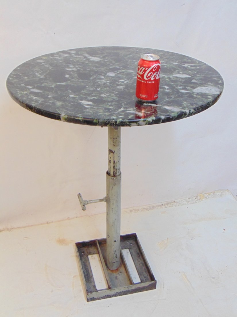 Marble top bistro table with industrial base, table is 28.5" in diameter, height is 36, (1 of 7)