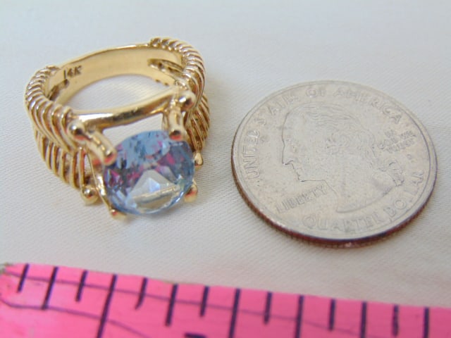 Jewelry. 14kt yellow gold Vintage ring with central faceted blue stone approx. 9mm, hallmark 14k, (1 of 4)