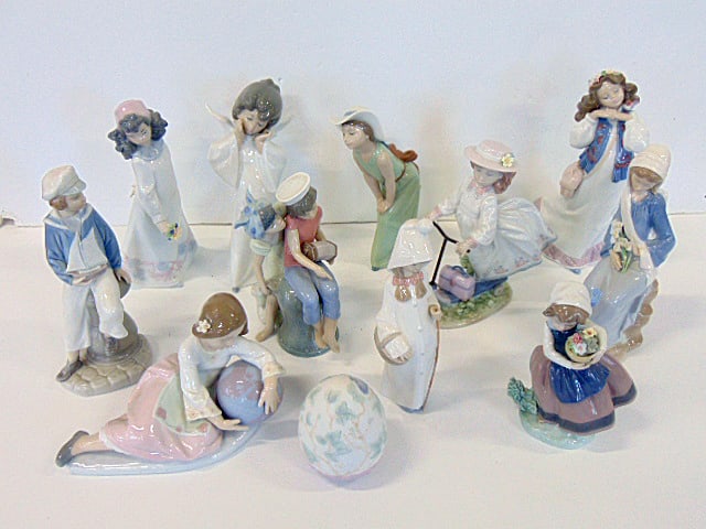 Lladro collection, includes 12 pieces, 11 figurines and an egg, boy with sailboat, various girls (1 of 14)