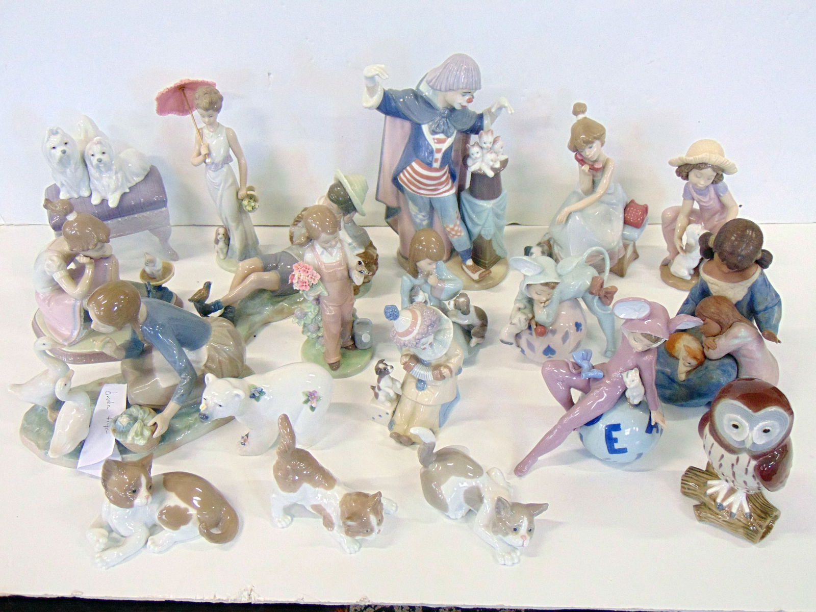 Lladro collection, includes 19 pieces, figues, animals, many figurines with kittens, girl with (1 of 19)