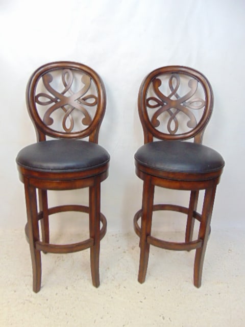 Pair barstools, rotating seats, black vinyl seats with carved wood frames, seat height is 30.25" (1 of 4)