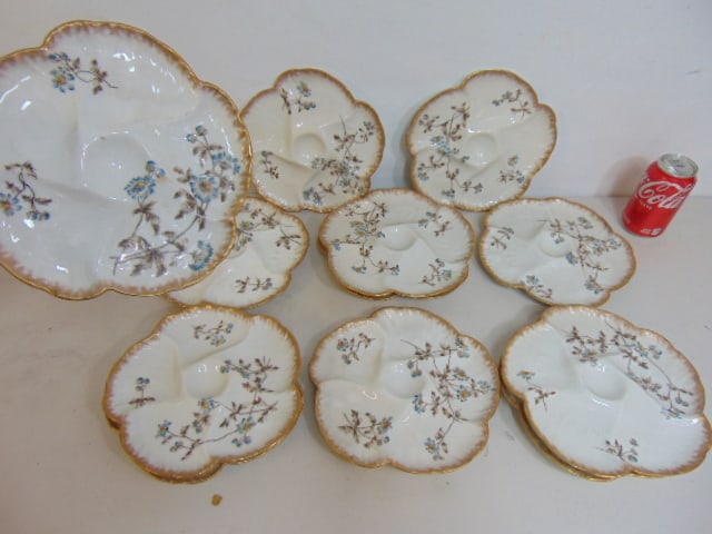 Set 11 porcelain oyster plates, floral decorated, 9" in diameter, one has chip on rim. (1 of 6)