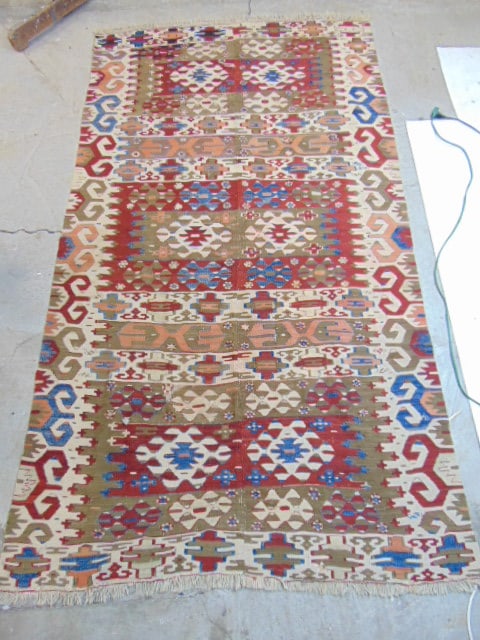 Flatweave carpet, some repairs, wear, in red, blue & ivory, rug is 98" by 54": Flatweave carpet, some repairs, wear, in red, blue & ivory, rug is 98" by 54"