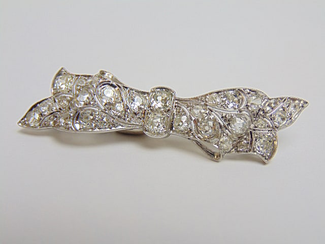 Jewelry. Antique Platinum Diamond bow bar pin. 7.54 grams 1 3.4" length. two round diamonds in the (1 of 6)