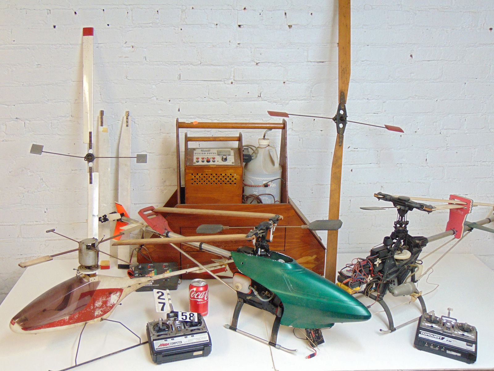 Remote control helicopter lot, includes three large sized helicopters, various parts, extra blades, (1 of 12)