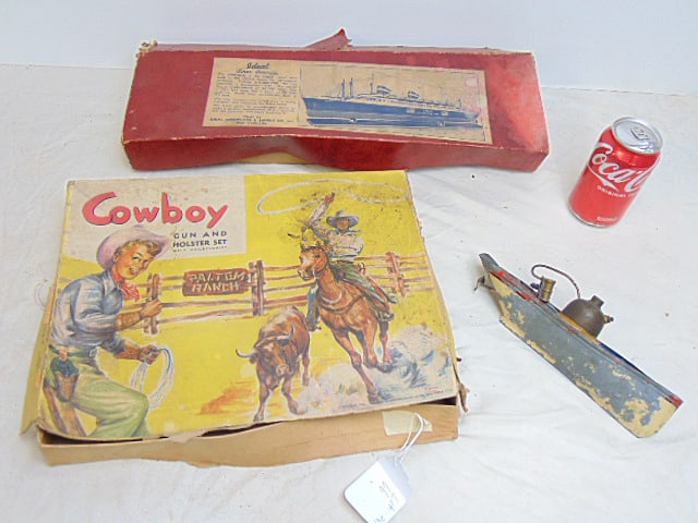 Toy lot, Cowboy Gun & Holster set in original box, "ideal" Liner America" kit wood hull with: Toy lot, Cowboy Gun & Holster set in original box, "ideal" Liner America" kit wood hull with cardboard upper structure kit, in original box & small steam powered (?) sloop, original paint mostly gone