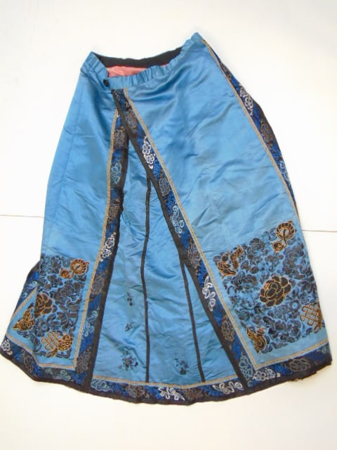 Chinese silk embroidered skirt, in blue with black vertical stripes, embroidered fish decoration: Chinese silk embroidered skirt, in blue with black vertical stripes, embroidered fish decoration accented with gold, tear, wear bottom edge, 31" long, width is 12"