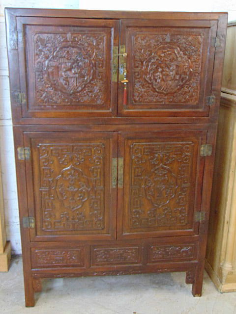 2 part Chinese carved cabinet, two door top over two door base, base is fitted with interior (1 of 6)