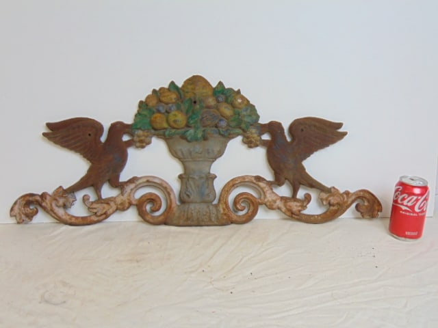 Cast iron crest, floral urn flanked by two birds, 31.25" wide, height is 12.5": Cast iron crest, floral urn flanked by two birds, 31.25" wide, height is 12.5"