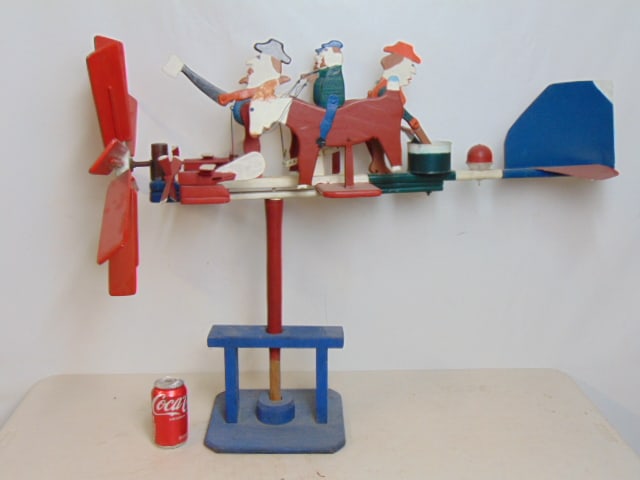 Early whirligig, 4 figures, 2 on horseback, one cutting wood with axe & woman with washboard, (1 of 7)