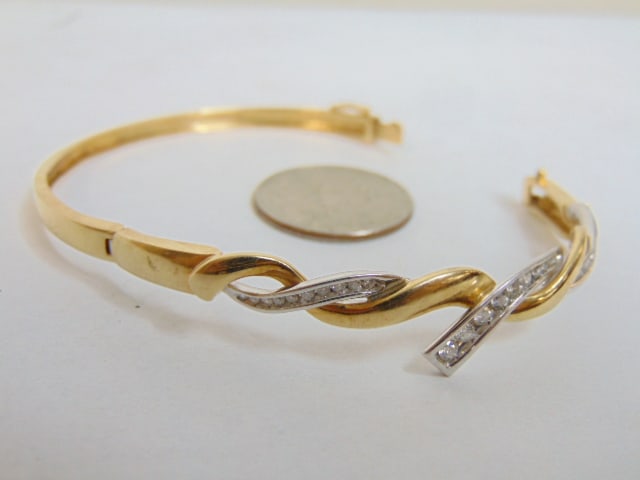 Jewelry. 14k Diamond & gold bracelet/bangle, 14.94 grams, three rows of graduated diamonds set in (1 of 4)