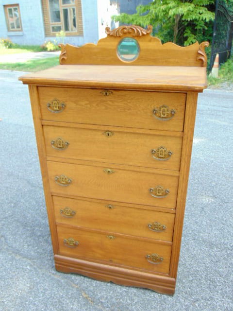 Oak chest drawers with backsplash holding a small round mirror, 5 drawers, chest is 33.75" wide, 20" (1 of 5)