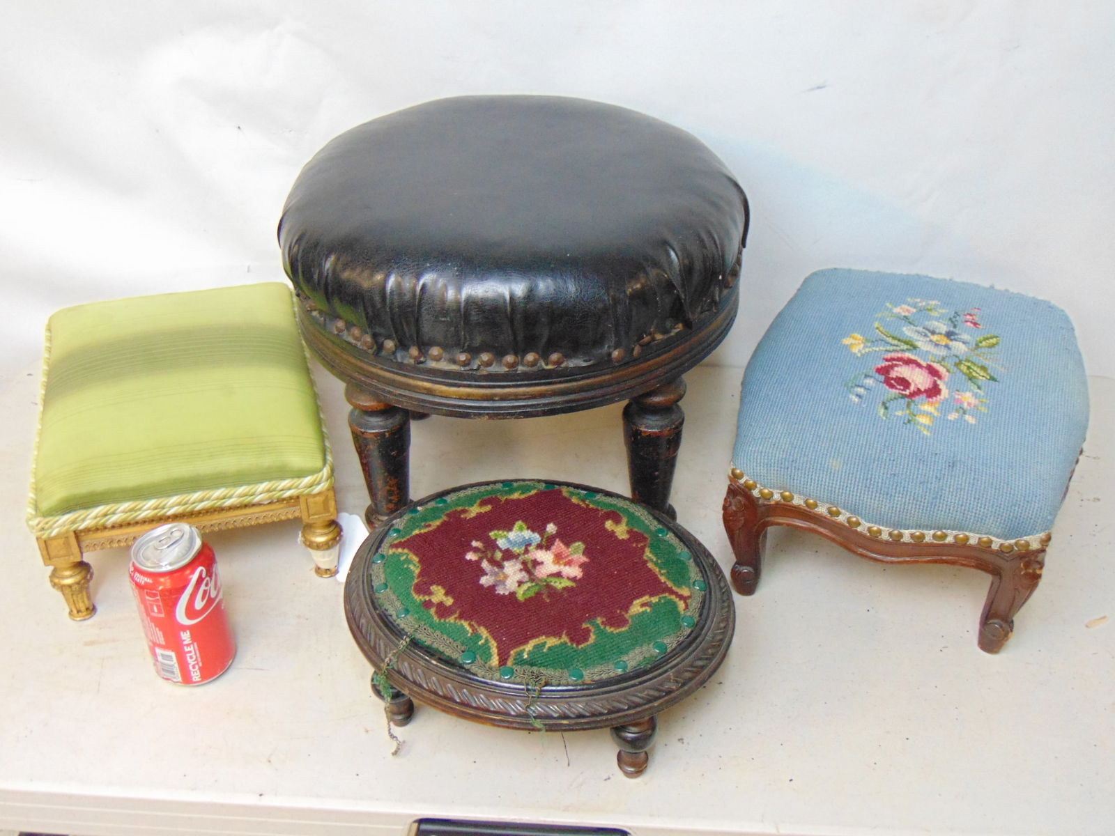 4 small footstools, two with embroidered seats. (1 of 5)