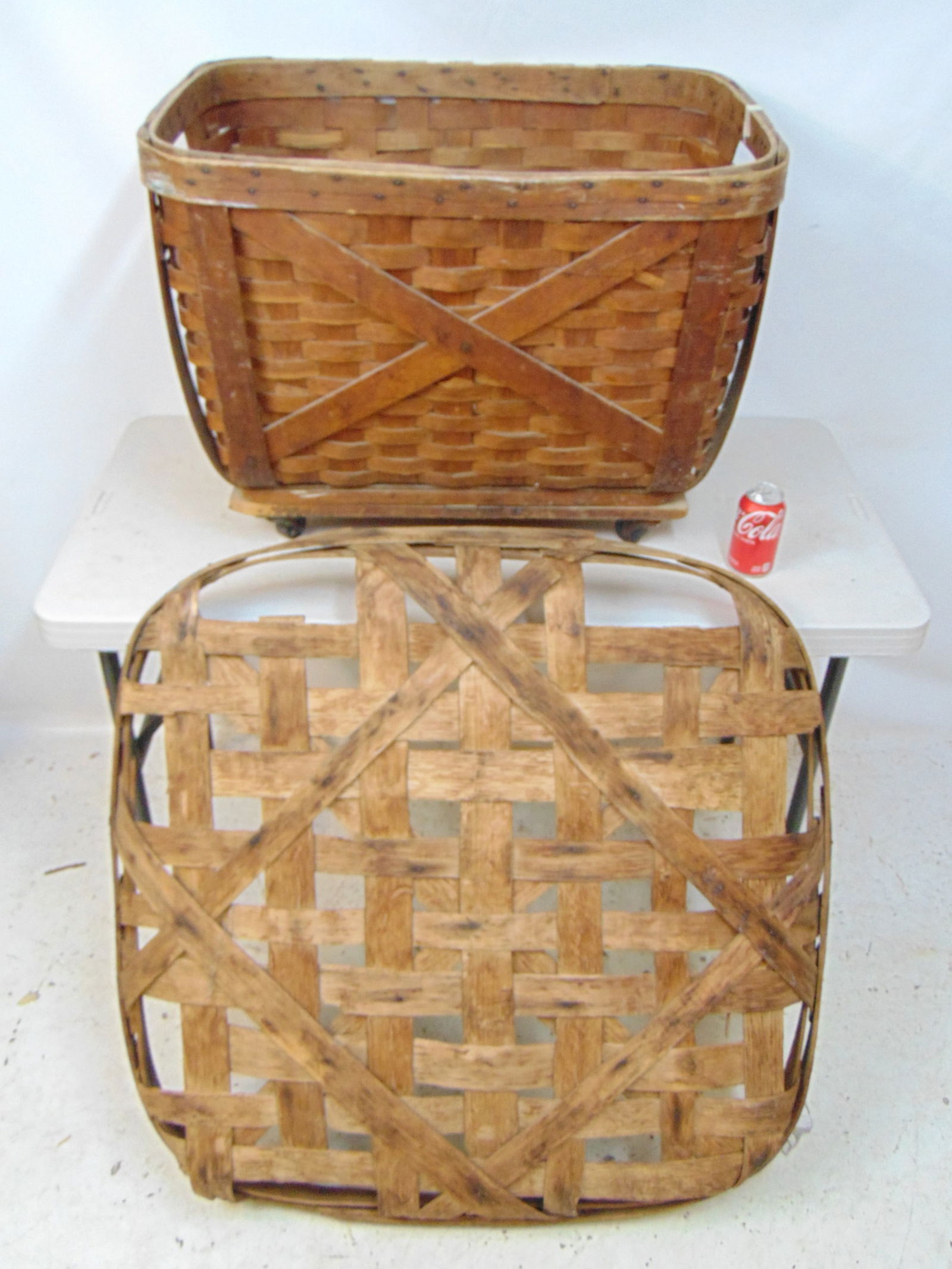 2 baskets, clothing basket on wheels & flat tobacco basket, 38" by 38", some loss. (1 of 5)