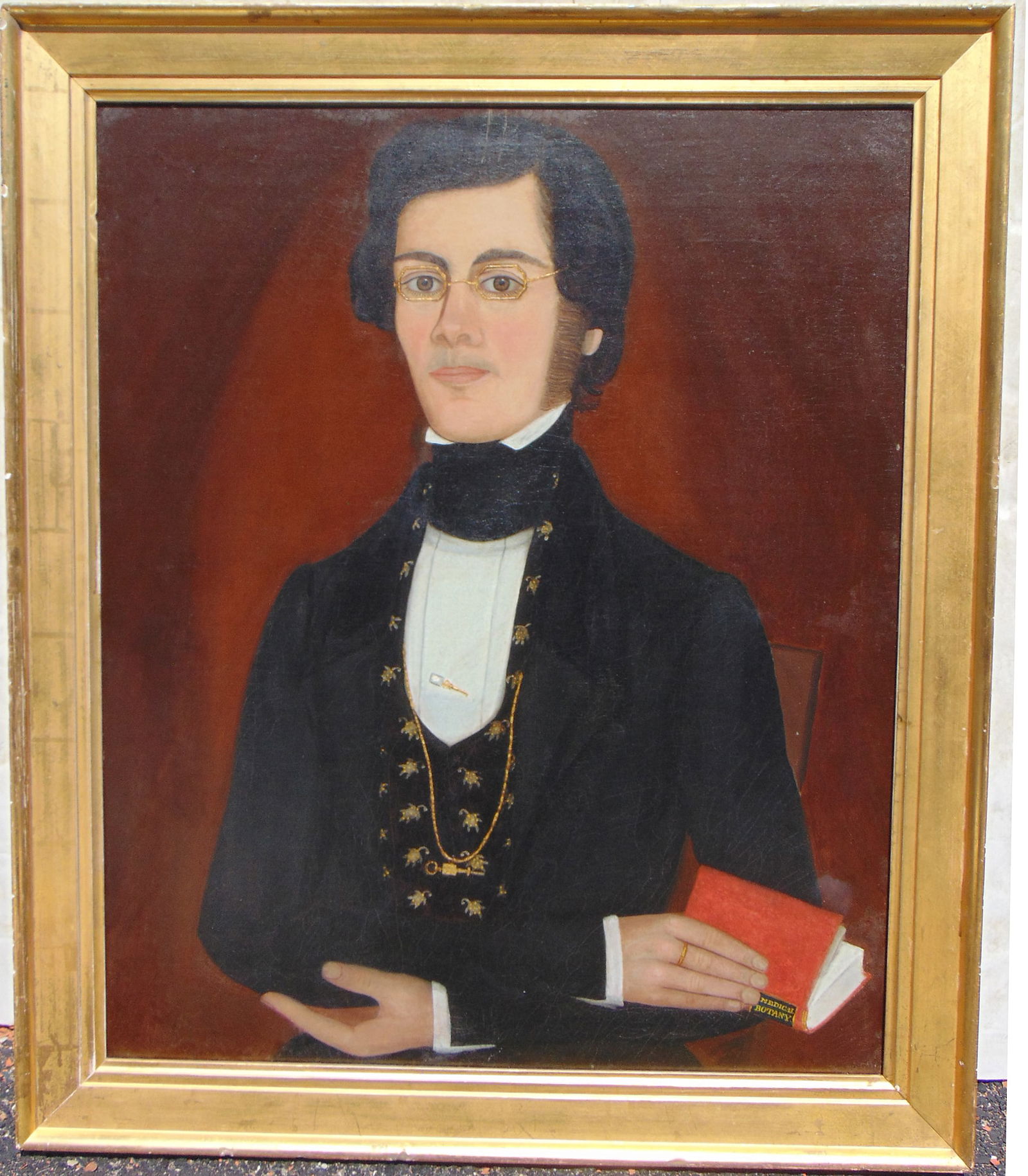 Portrait of a gentleman holding Medical Botany book, oil on canvas (relined), gentleman in black: Portrait of a gentleman holding Medical Botany book, oil on canvas (relined), gentleman in black coat and floral decorated waistcoat, octagonal shaped eyeglasses, spectacles, gold stickpin, chain, Phi