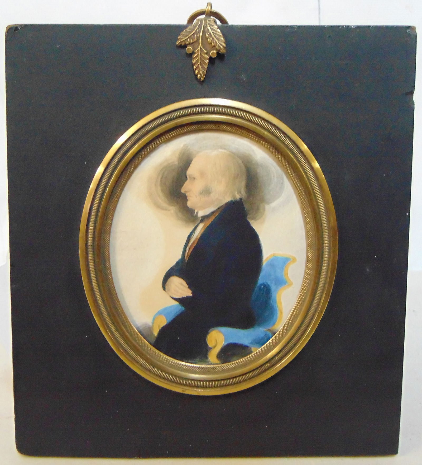Miniature portrait of a gentleman seated in a blue chair, right arm over chest, in black coat, circa (1 of 6)