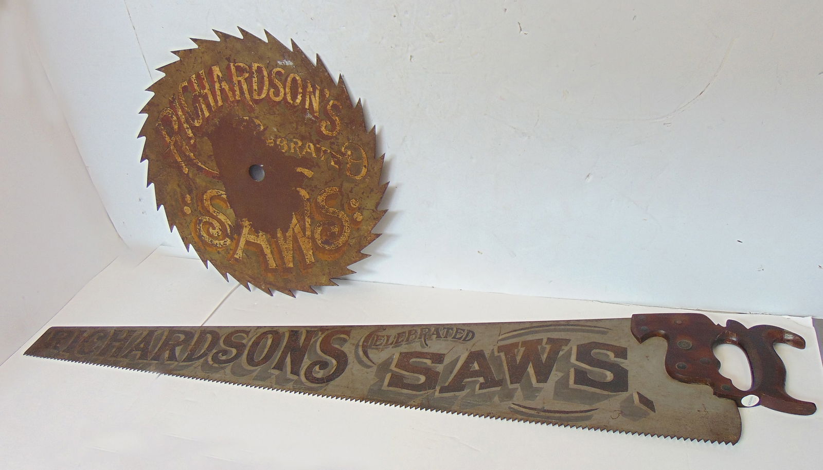 Trade signs two saws for "Richardson's Celebrated Saws" painted on a circular saw blade and a hand (1 of 9)