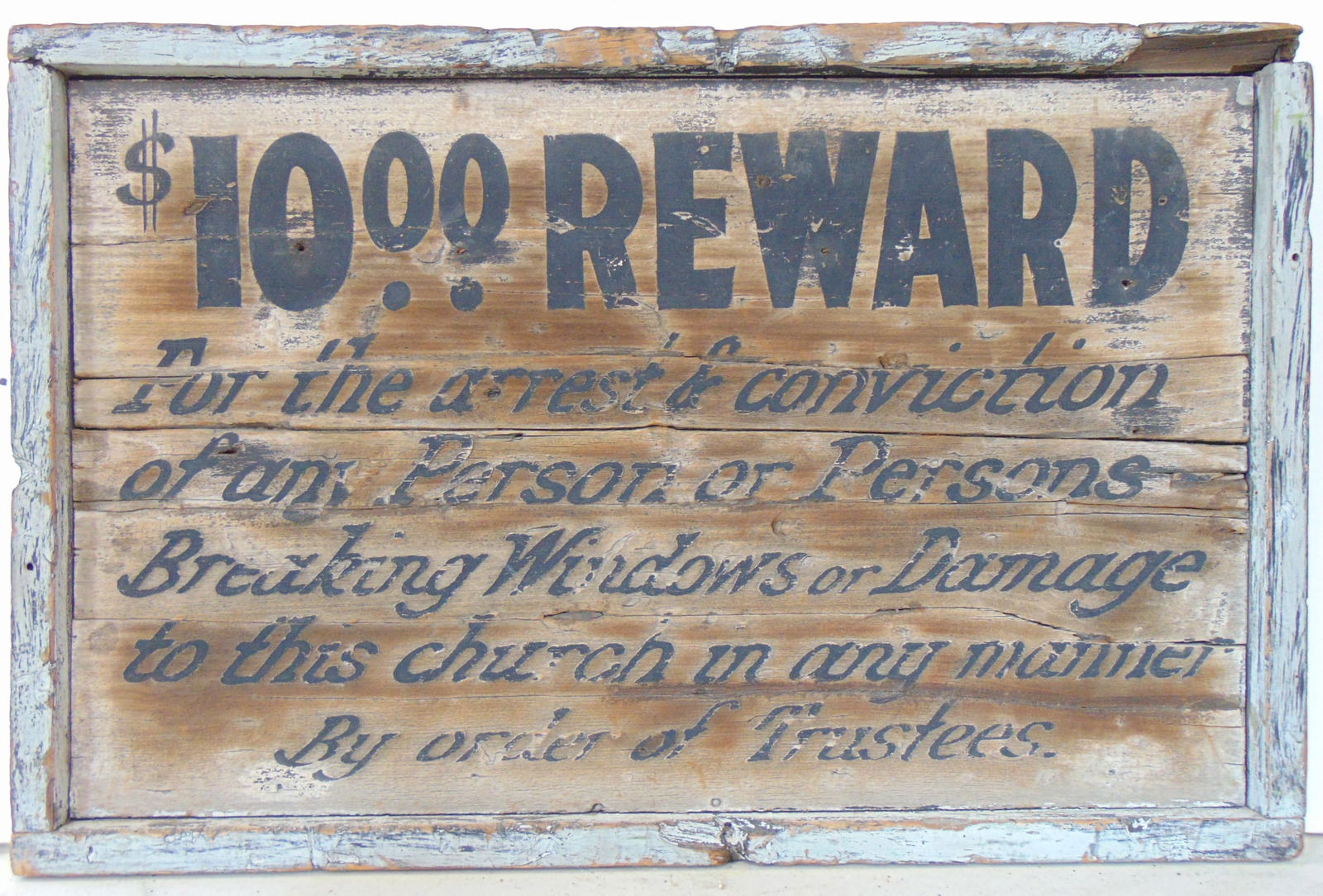 Sign, painted wood sign, weathered "$10.00 REWARD For the arrest & conviction of any Person or: Sign, painted wood sign, weathered "$10.00 REWARD For the arrest & conviction of any Person or Persons Breaking Windows or Damage to this church or any manner By order of Trustees"16" x 24"
