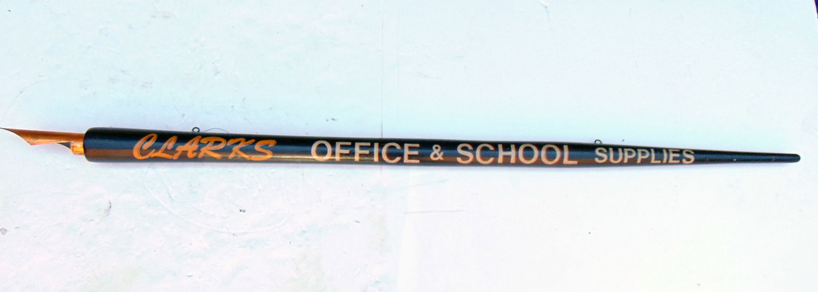Trade sign "CLARKS OFFICE AND SCHOOL SUPPLIES" in gilt on a 78" wooden and brass ink pen from a (1 of 8)