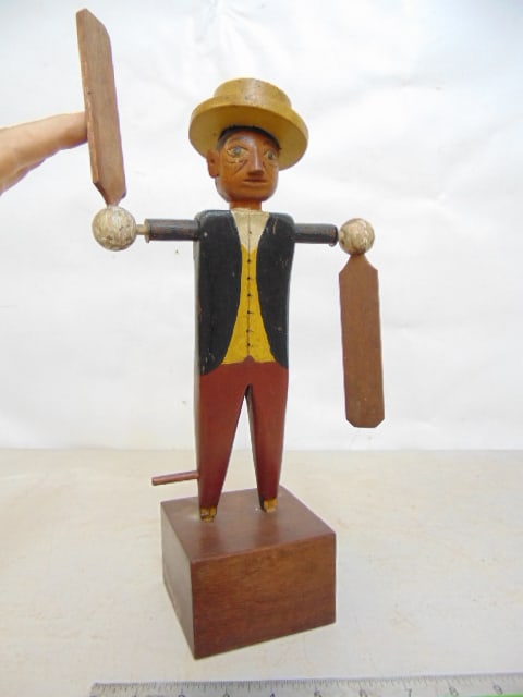 Folk art figural whirligig, man in coat with hat, wood base, height is 14" (1 of 5)