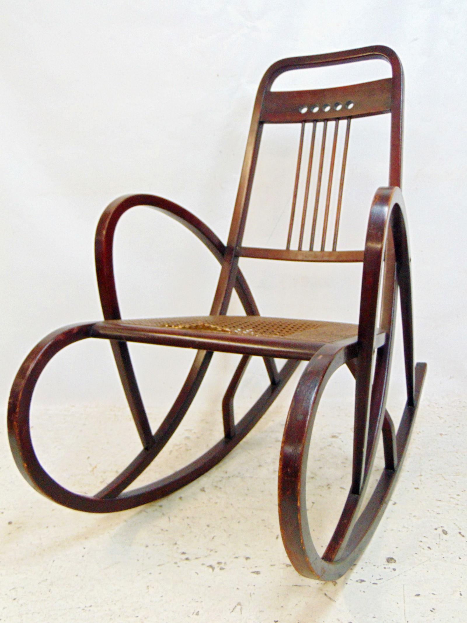 Authentic Thonet rocker, model 511, caned seat, caning is as is, light scratches on frame from: Authentic Thonet rocker, model 511, caned seat, caning is as is, light scratches on frame from normal use.