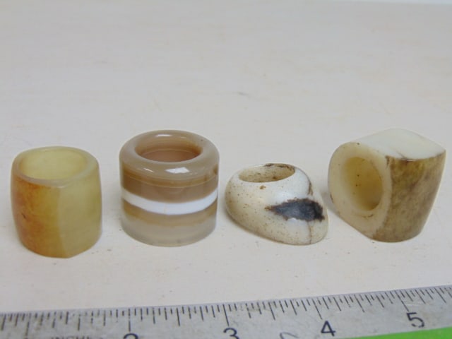 4 Chinese archer rings, carved stone, Jade, various designs last of the collection (1 of 10)