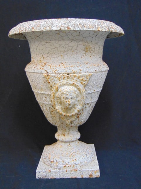 Cast iron garden urn in old white paint, with applied portraits, height is 20.5": Cast iron garden urn in old white paint, with applied portraits, height is 20.5"