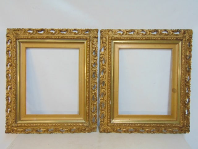 Pair gold painted carved frames, 20.25" by 16.25" opening, total size is 30.75" by 26.75": Pair gold painted carved frames, 20.25" by 16.25" opening, total size is 30.75" by 26.75"