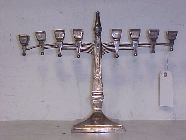 Silver Menorah: Silver Menorah, slighty tilted, tarnished, star of david on base, 14" tall, 19.25" wide, hallmarked on side of base