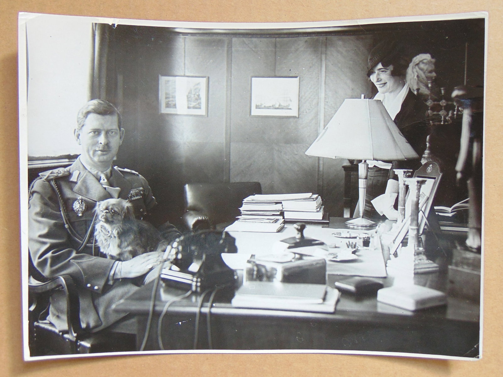 Iosif Berman photograph, King Carol II king of Romania holding a small dog by his desk with Anita: Iosif Berman photograph, King Carol II king of Romania holding a small dog by his desk with Anita Daniel, Romanian-born German-American author and journalist, 6.75" by 9.25"