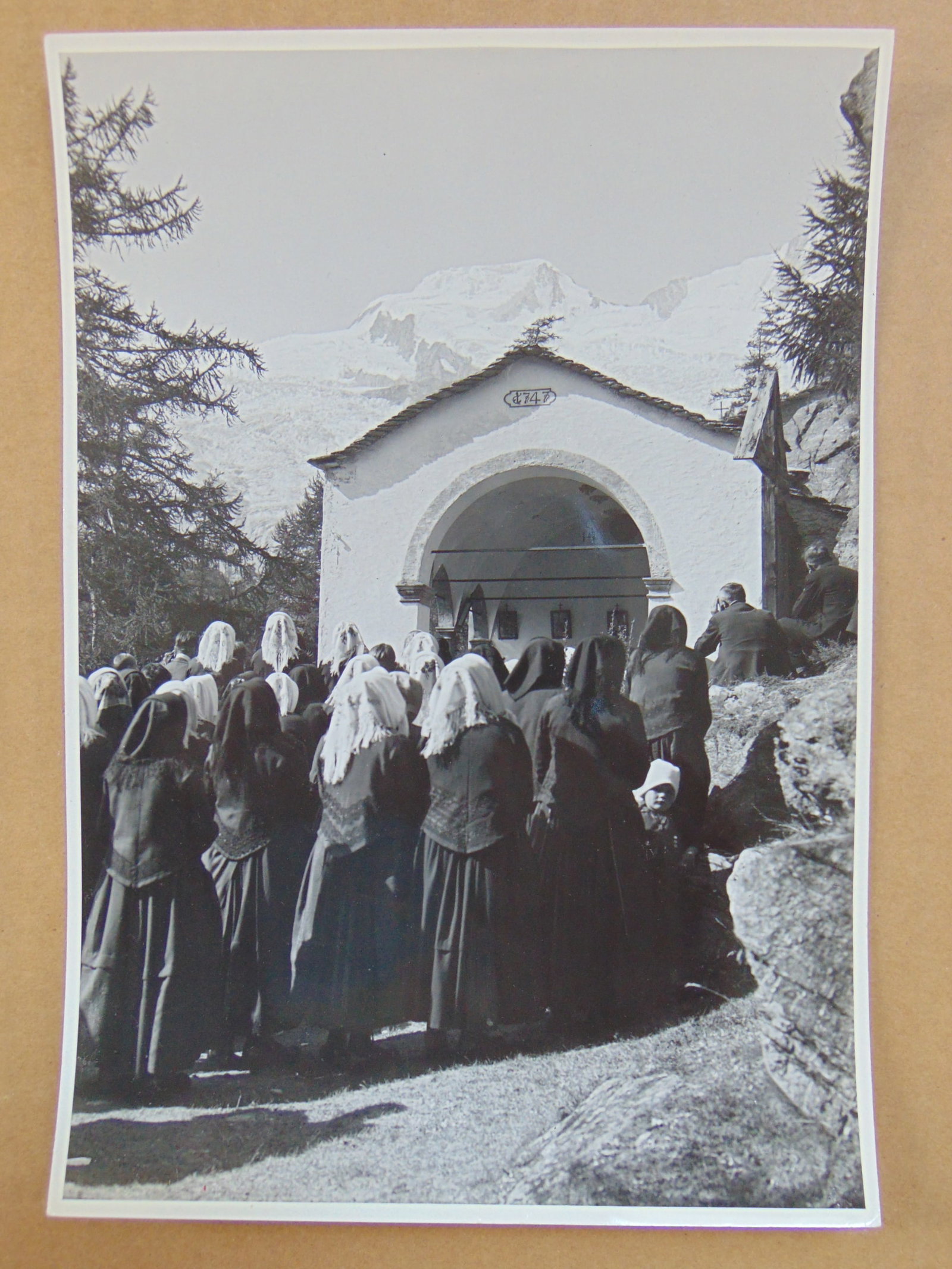 Photograph, Arnold Klopfenstein, villagers walking towards small church, mountains in distance,: Photograph, Arnold Klopfenstein, villagers walking towards small church, mountains in distance, Adelboden, 6.25" by 9.25"
