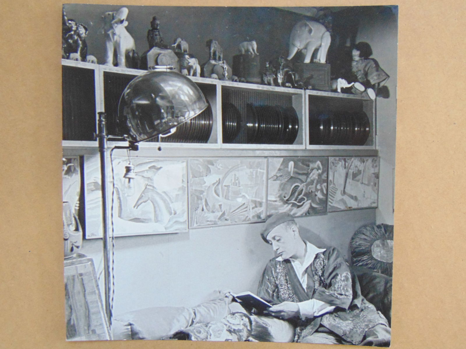 Alfred Eisensteadt photograph, unidentified artist (Stephan ?) reading a book, 4 paintings visible (1 of 6)