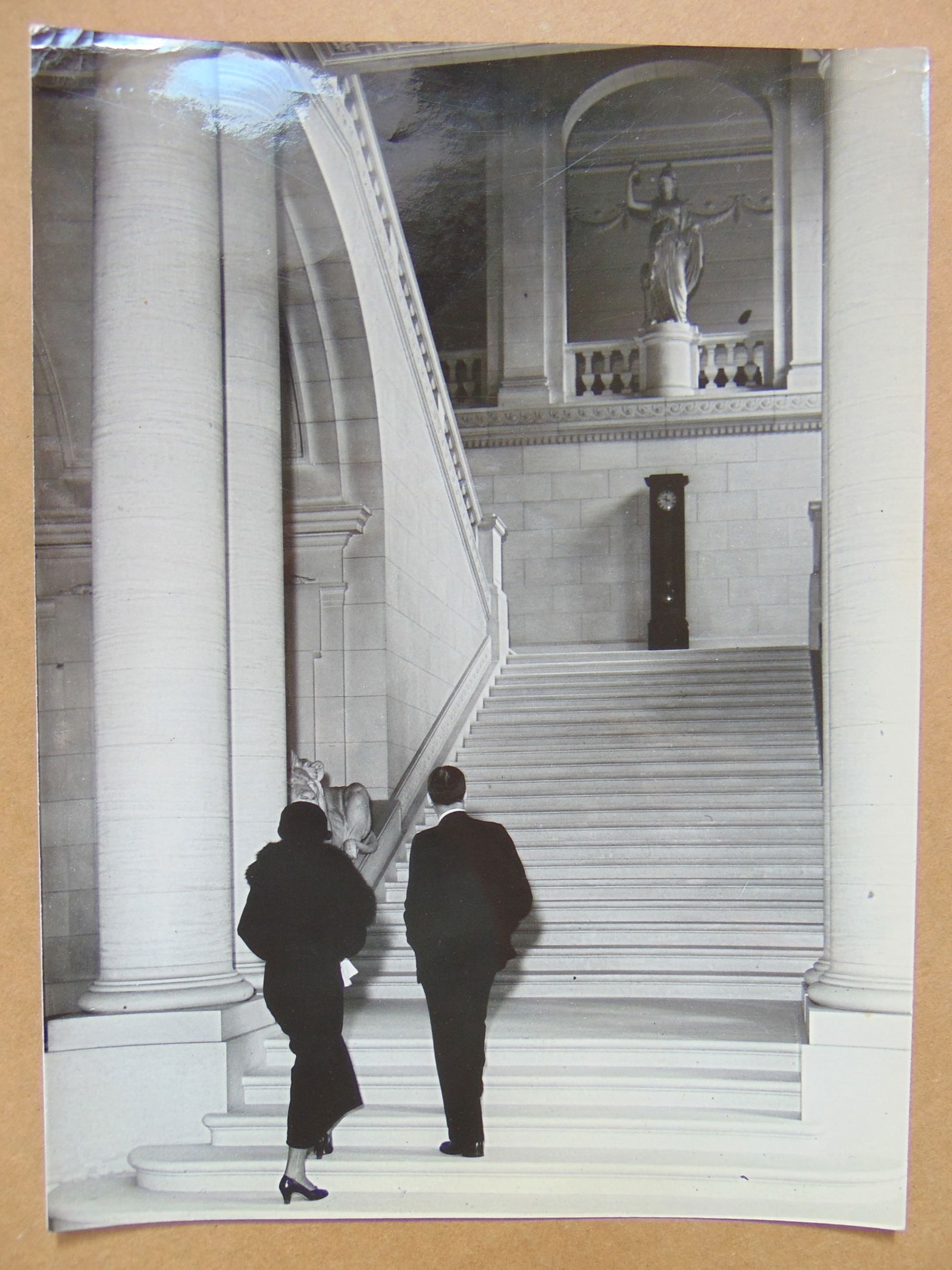 Photograph by Alfred Eisenstaedt, elegant dressed woman & man in suit at bottom of large staircase, (1 of 4)