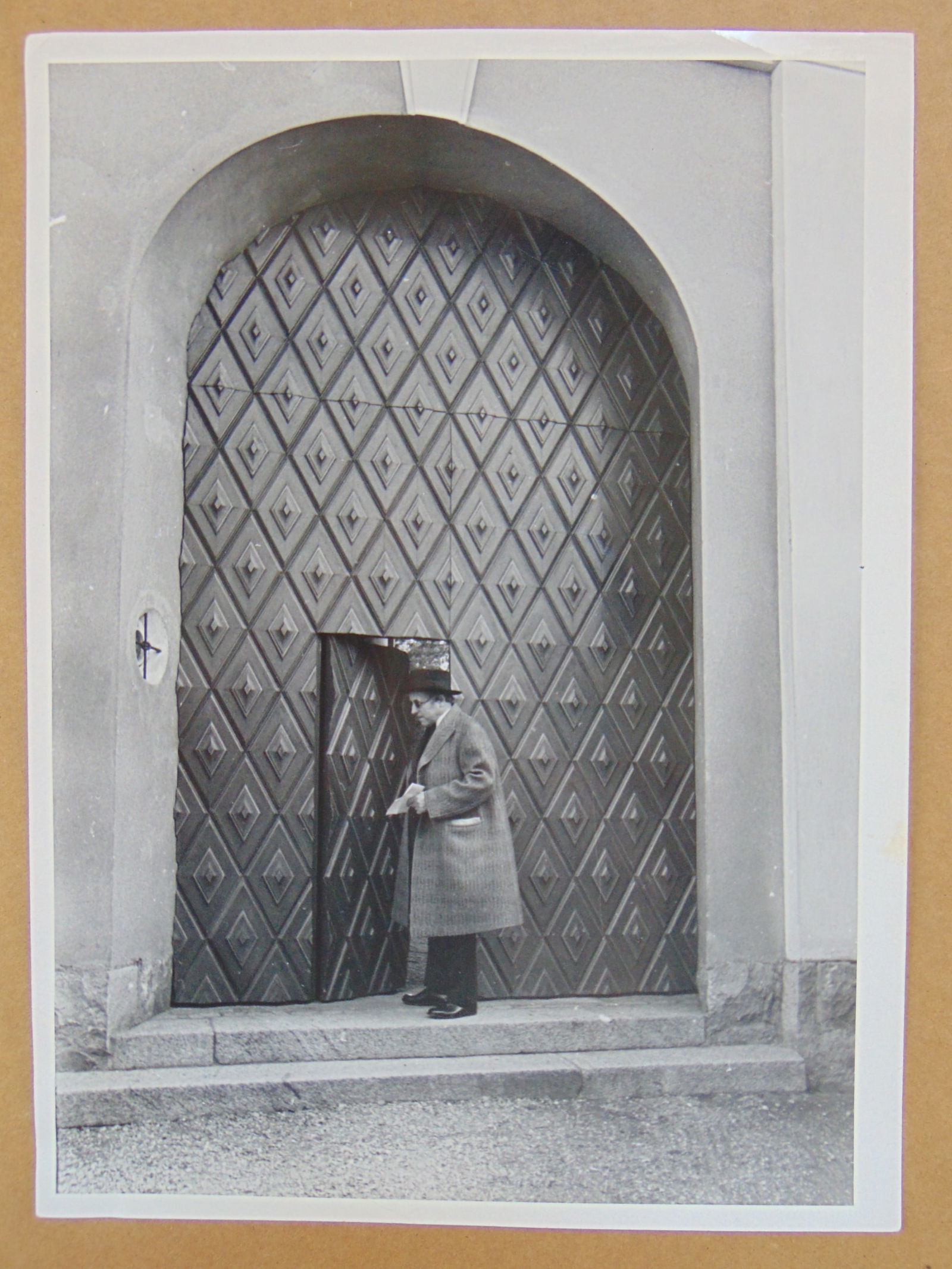 Photograph, attributed to Alfred Eisenstaedt, figure, possibly Swedish sculptor Carl Milles exiting (1 of 4)