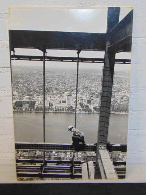 Guy Gillette photograph, steelworker working on skyscraper with MIT in background, Photograph by Guy: Guy Gillette photograph, steelworker working on skyscraper with MIT in background, Photograph by Guy Gillette, represented by Virginia Davis, 19" by 13"