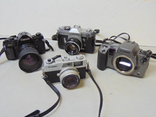 4 Canon cameras, Canon A-1 with 28-80mm lens; Canon FX with Canon 50mm lens; Canon Canonet 28 with (1 of 11)