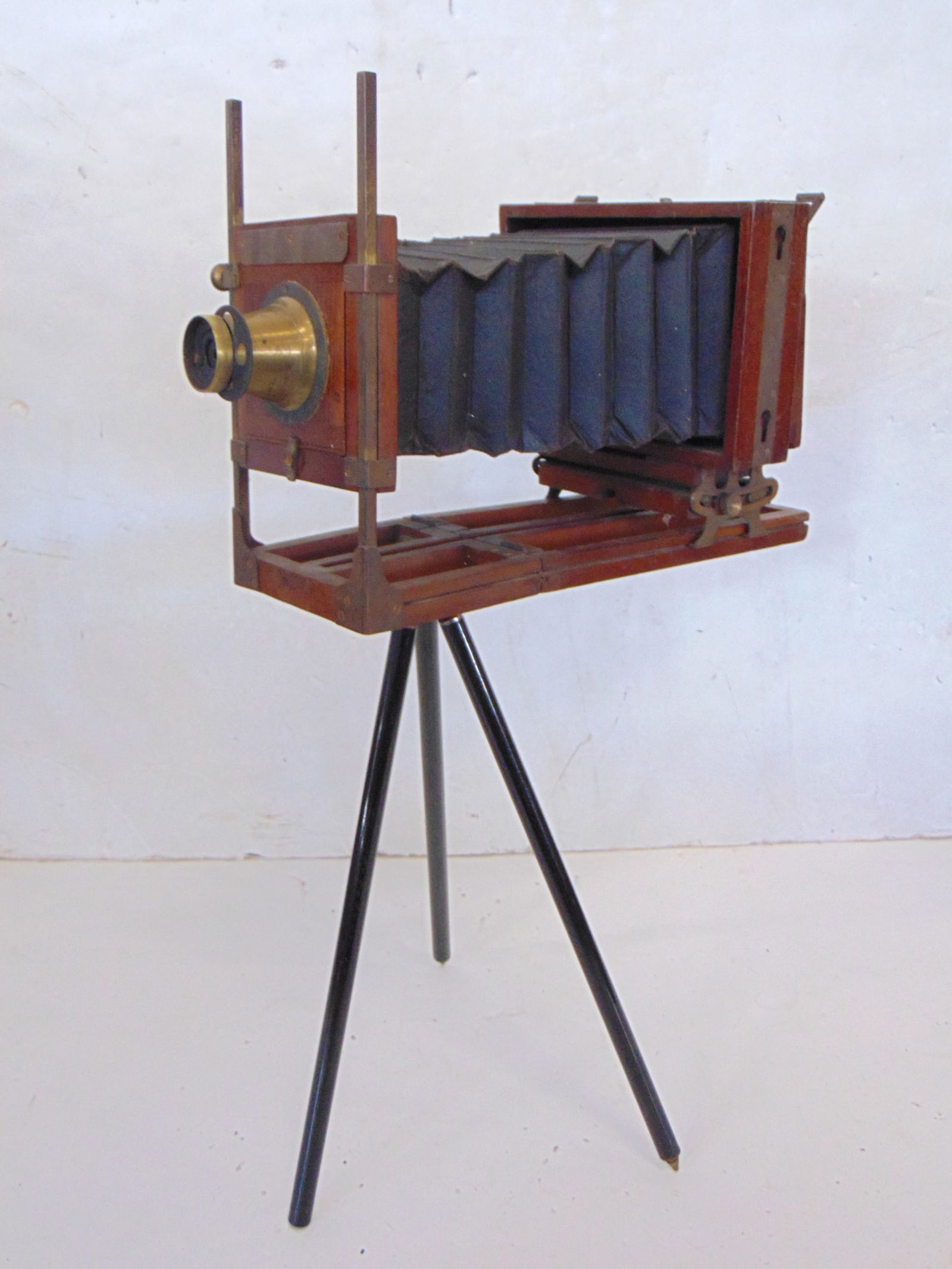Vintage wood folding camera on metal tripiod base, no marking on camera, lens marked E. & H.T. (1 of 5)