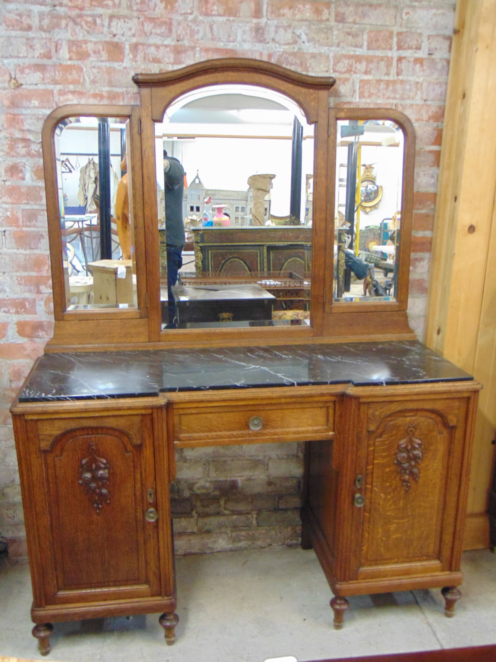 Oak marble top vanity with triple panel mirror, with black marble top and carved detail on doors, (1 of 5)