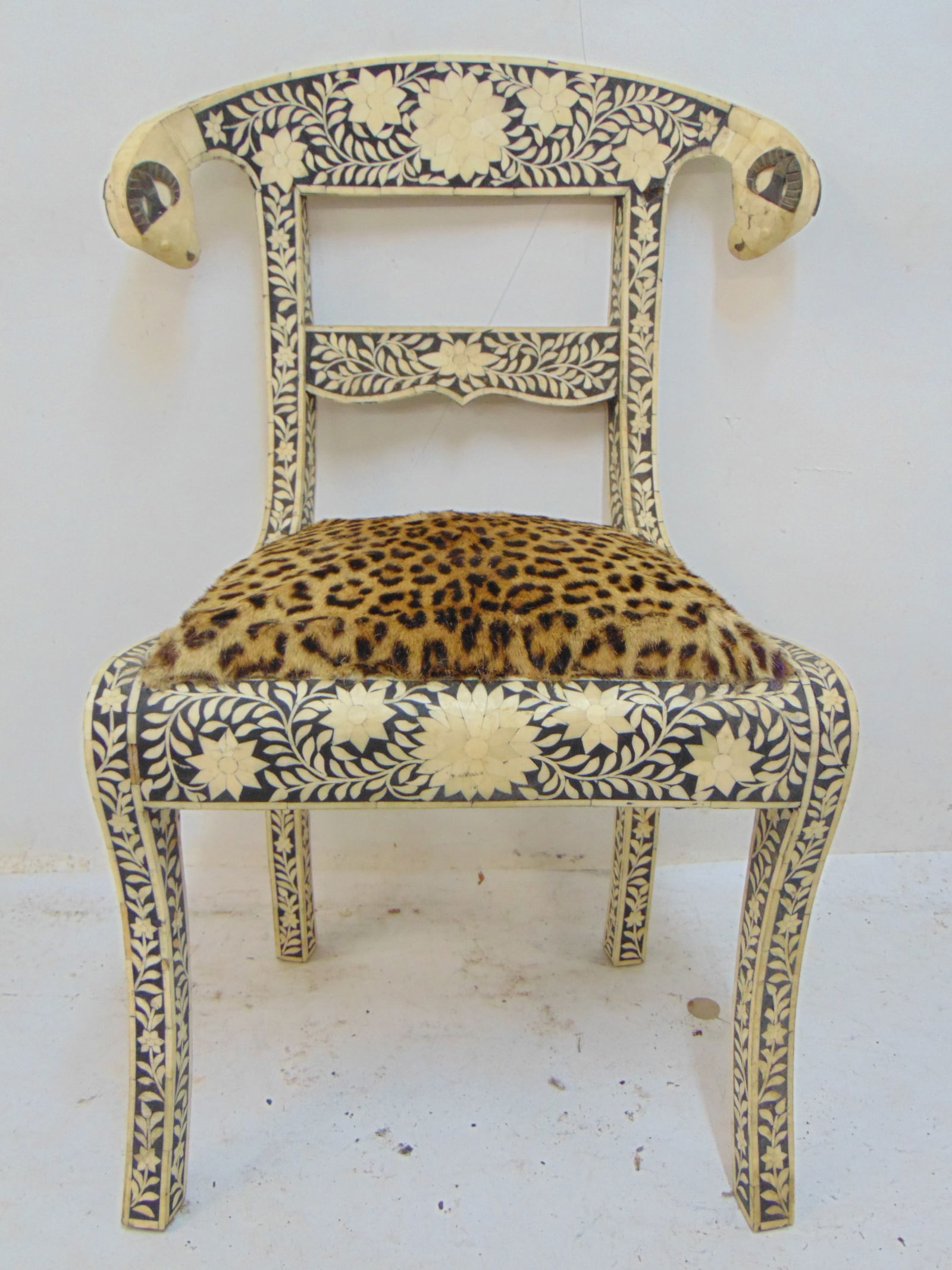 Decorative side chair with inlaid floral bone patterns & rams heads, leopard print seat.: Decorative side chair with inlaid floral bone patterns & rams heads, leopard print seat.