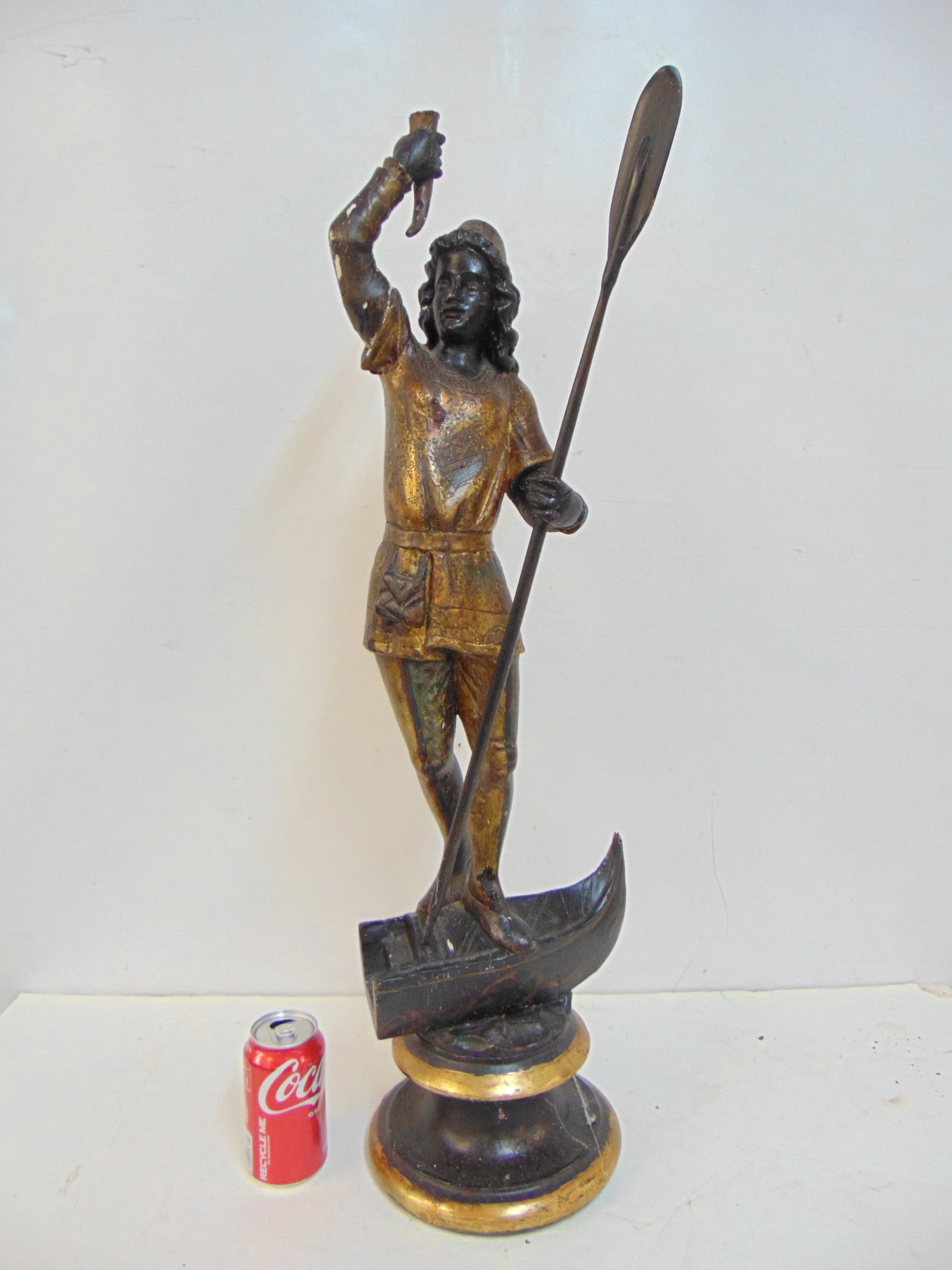 Italian carved wood gondolier carving, in black with gilt highlights, Venetian gondolier holding an (1 of 6)