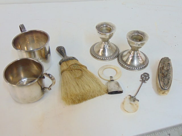 Sterling lot, brush, 2 cups, pair weighted sticks, small bell on mother of pearl ring.: Sterling lot, brush, 2 cups, pair weighted sticks, small bell on mother of pearl ring.