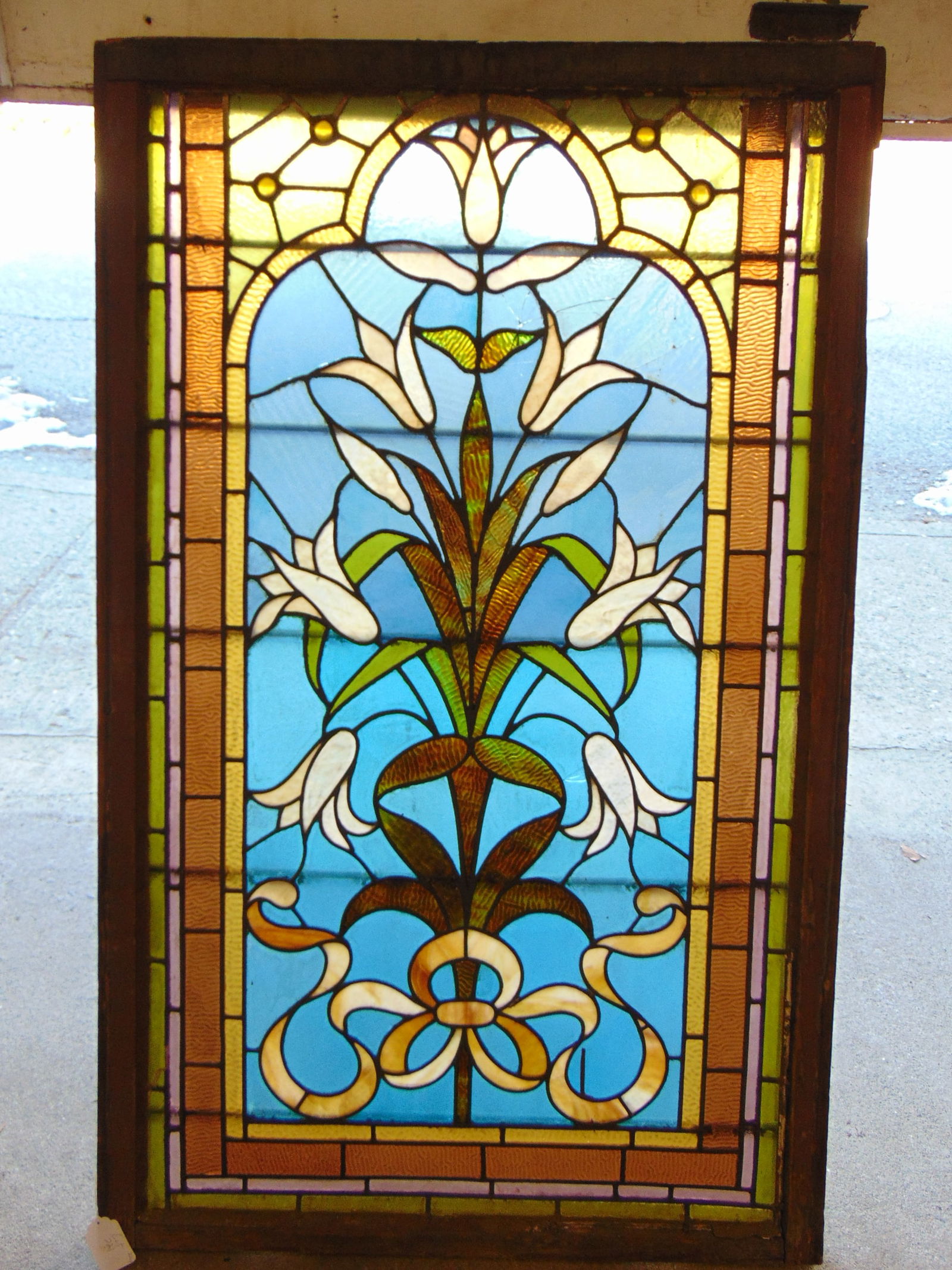 Leaded glass window, floral & ribbon decorated, window is 54.5" by 34", has several cracked panels. (1 of 7)