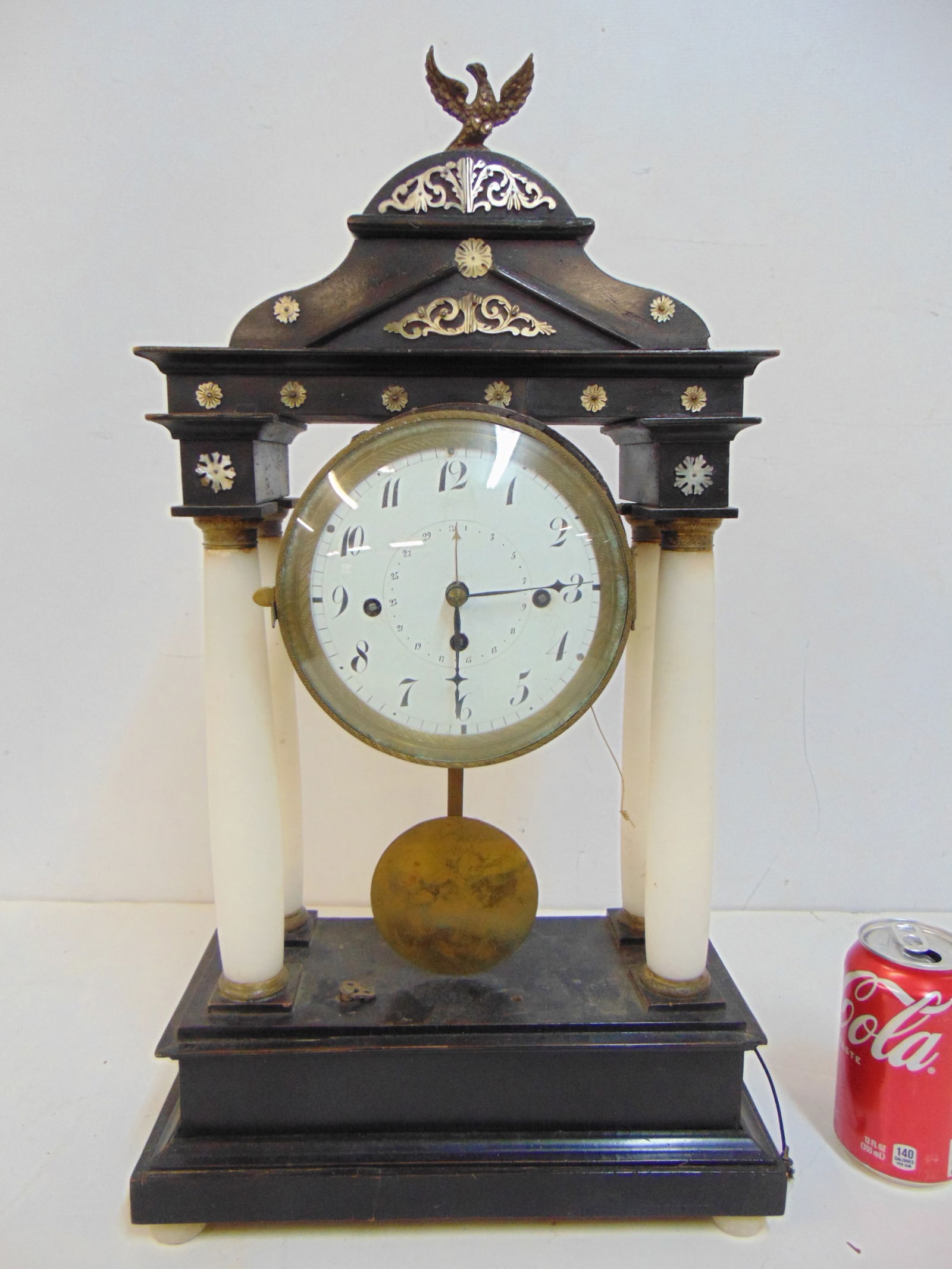 Mantle Clock with ebonized case on alabaster columns, has music box in base, clock is 20" tall, (1 of 5)