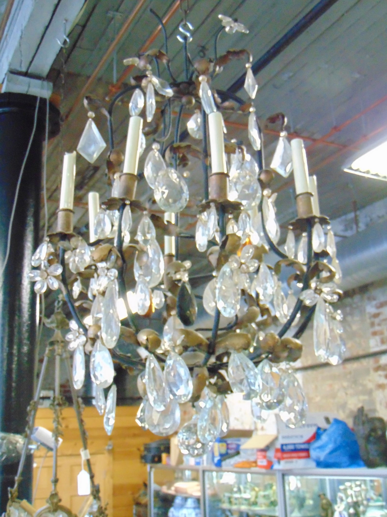 Iron chandelier with large crystals, decorated with gold painted leaf decoration, 8 arms, fixture is (1 of 4)